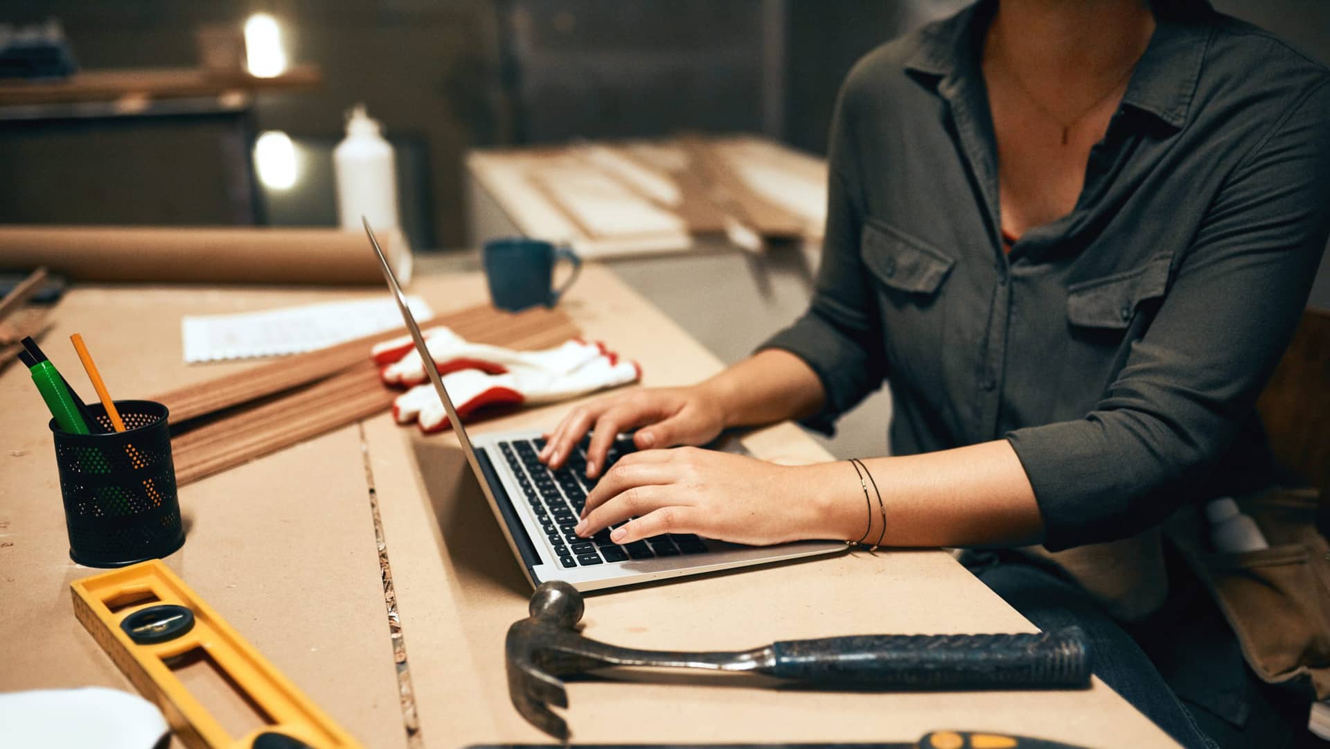 Woman designing her own website with a diy website builder